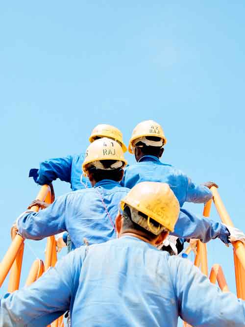 brown and white mountains under white clouds and blue sky during daytime